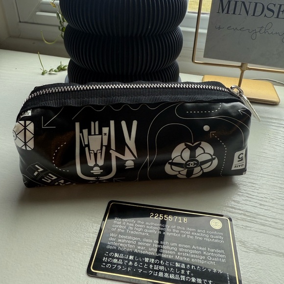 CHANEL Handbags - CHANEL Rare Black and White Airline Pouch - collector’s item